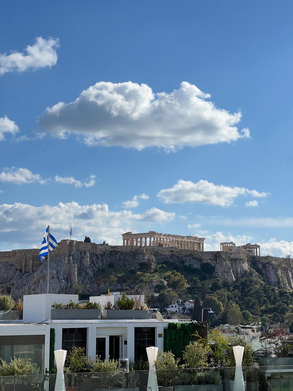 Athens rooftops with the Acropolis glowing at golden hour